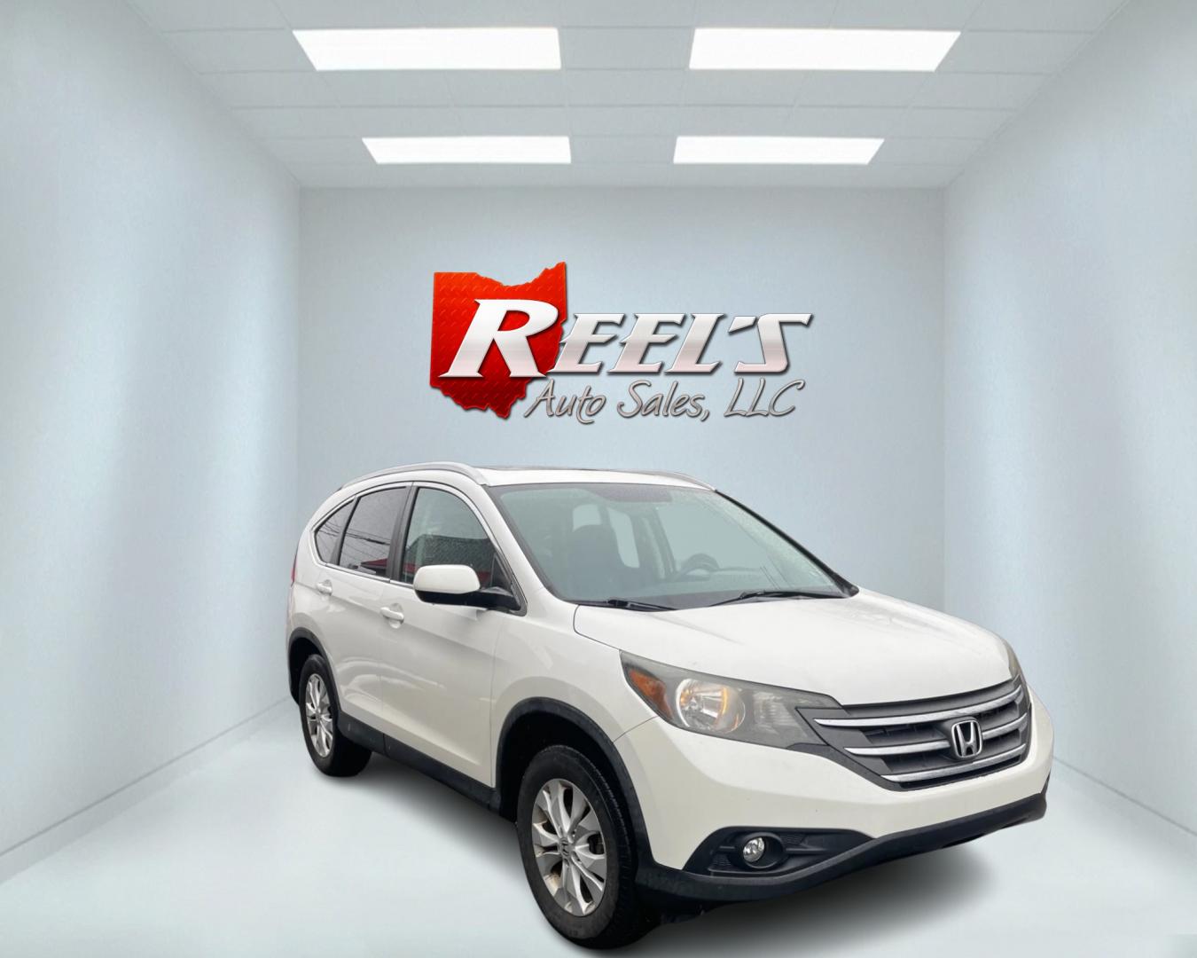 2013 White /Black Honda CR-V EX-L 4WD 5-Speed AT (5J6RM4H71DL) with an 2.4L I4 DOHC 16V engine, 5-Speed Automatic transmission, located at 11115 Chardon Rd. , Chardon, OH, 44024, (440) 214-9705, 41.580246, -81.241943 - This 2013 Honda CR-V EX-L AWD boasts a reliable 2.4L engine paired with a 5-speed automatic transmission, catering to drivers seeking both efficiency and all-wheel-drive capability. Its single-owner status may reassure potential buyers about its maintenance history. Luxurious features such as a leat - Photo#2